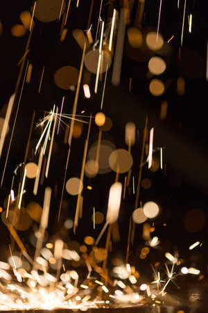 Glowing Flow of Sparks in the Darkの写真素材