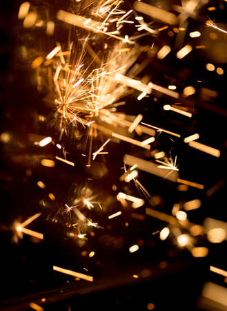 Glowing Flow of Sparks in the Darkの写真素材