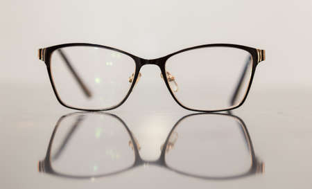 Brown glasses close-up. Glasses in a modern style. Glasses with clear lenses. fashionable accessoriesの写真素材