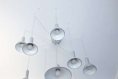 decorative lamps on a white ceilingの写真素材