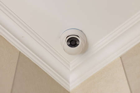 surveillance camera on the white ceiling