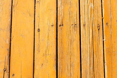 wood texture painted yellow with paintsの写真素材