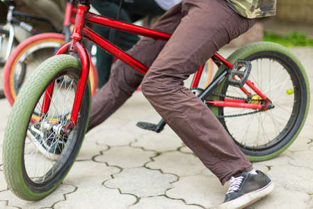 BMX bike in the park, they show complex bike tricks and get huge adrenaline
