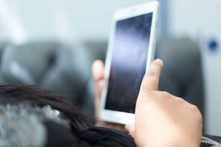 tablet in a female handの写真素材