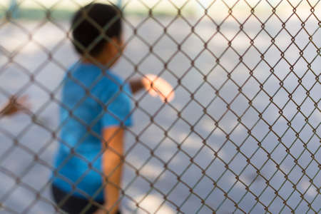 Blurred image Children and teenagers playing soccer at an indoor stadium.の写真素材