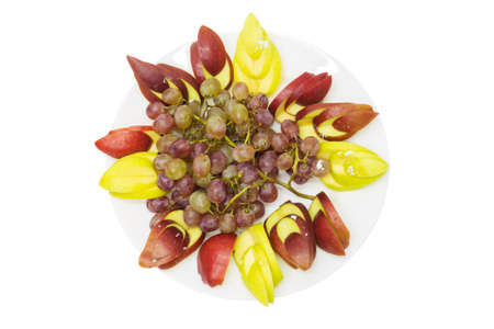 fruit dessert from apples, grapes isolated on a white backgroundの写真素材