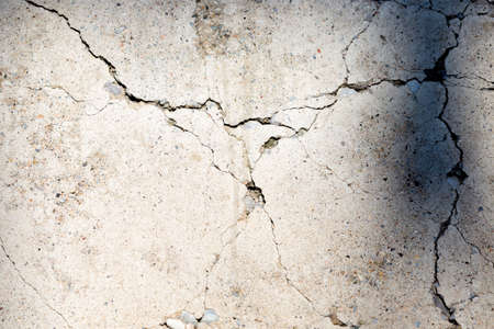 cracked concrete cement wall in industrial building, great for your design and texture background