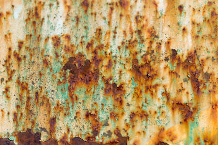 Rusty Colored Metal with cracked paint, grunge background