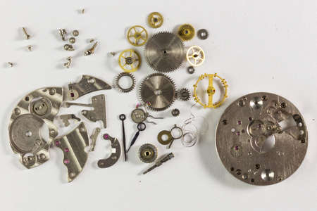 Spare parts from mechanical watches on a white backgroundの写真素材
