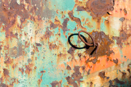 Rusty Colored Metal with cracked paint, grunge backgroundの写真素材