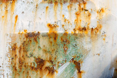 Rusty Colored Metal with cracked paint, grunge backgroundの写真素材
