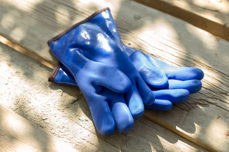 warm, blue rubber glove for construction work in the coldの写真素材