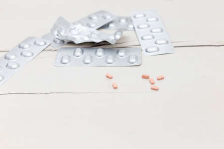 Colorful medical pills on the table, for your text
