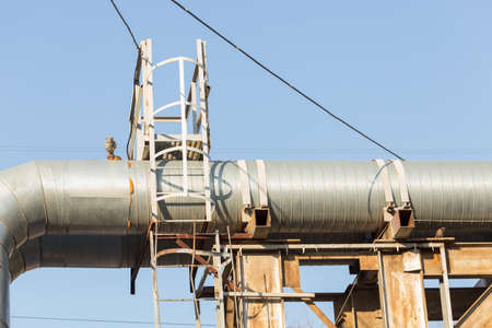 Part of the external heating system in the form of metal pipes and faucets close-up.の写真素材