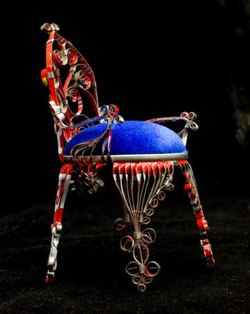 doll chair from a bottle of hairspray on a black background, handmadeの写真素材