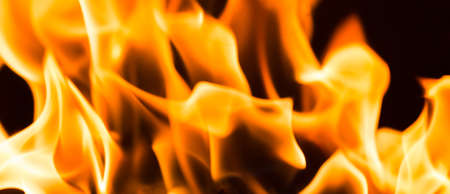 Fire flame burning glowing on black dark background, hot heat energy fuel fire motion pattern...