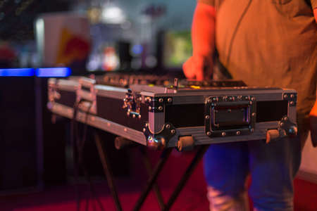 DJ mixing in a karaoke bar. Soft focus on hand - a concept of entertainment, youth, entertainment...