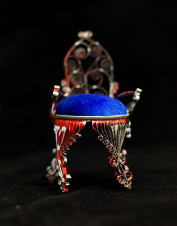 doll chair from a bottle of hairspray on a black background, handmadeの写真素材