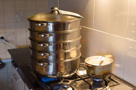 Juicy korean manti on a gas stove in a double boiler. Cooking delicious dishes, national Korean cuisineの写真素材