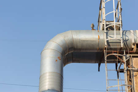 Part of the external heating system in the form of metal pipes and faucets close-up.の写真素材
