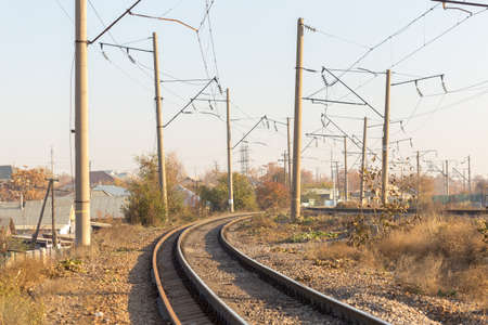 railway rails pillars wire horizonの写真素材
