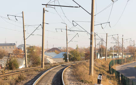 railway rails pillars wire horizonの写真素材