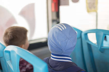 children returning home after school by busの写真素材