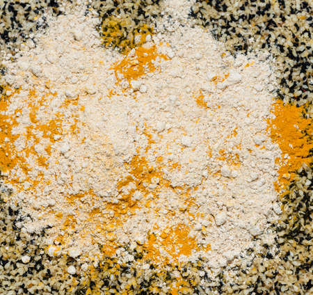 background of sesame seeds, caraway seeds, turmeric and dry gingerの写真素材