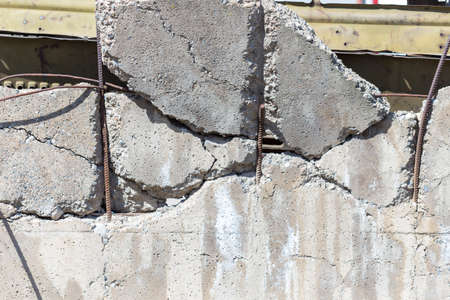 concrete fence, cracked cement wall in an industrial buildingの写真素材