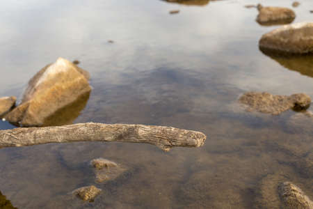 Discharge of water from a dam into a riverの写真素材