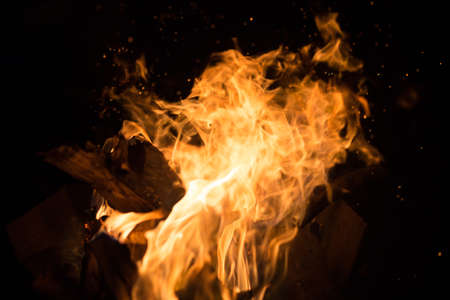 Fire creates endless shapes as it burns, flames and black backgrounds create interesting textures. Flame of Hell. Combustion power.の写真素材