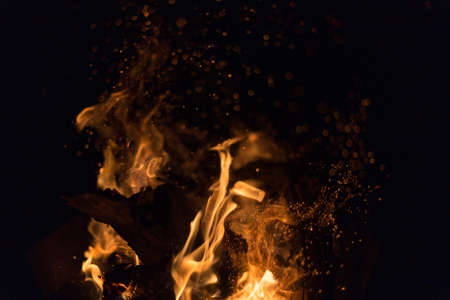 Fire creates endless shapes as it burns, flames and black backgrounds create interesting textures. Flame of Hell. Combustion power.の写真素材