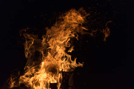 Fire creates endless shapes as it burns, flames and black backgrounds create interesting textures. Flame of Hell. Combustion power.の写真素材