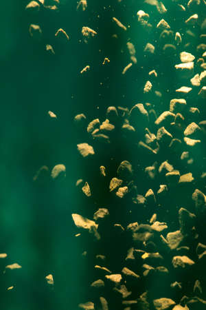 Flying coffee beans isolated on black background. Roasted coffee beans against a flash of lightの写真素材
