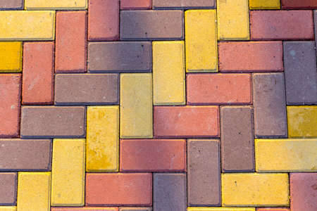 background paving stones of different colors for the sidewalkの写真素材