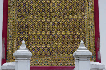 golden temple door in thailandの写真素材