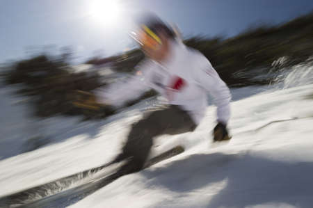 Motion blurred image of an expert skier, Stowe, VT, USAの写真素材