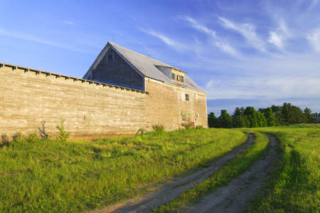 Old grey weathered barn  at sunset in Stowe, Vermont, USA