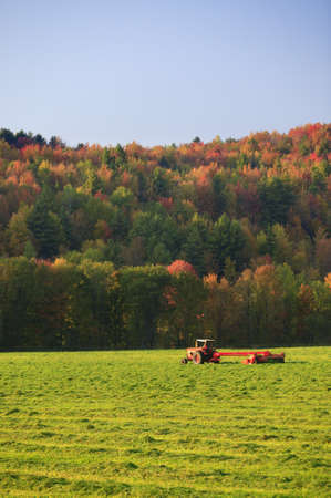 Old farm tractor in a mowed field in Stowe Vermont, USAの写真素材