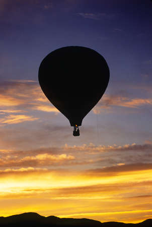Hot air balloon at sunset over Mt  Mansfield, Vermont, USAの写真素材