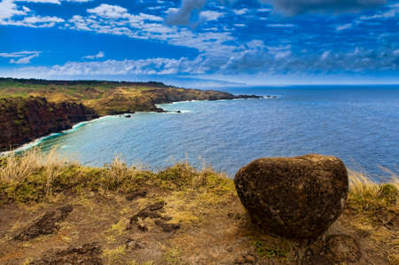 Boulder on a edge of cliff overlooking the Pacific Ocean, Maui, Hawaii, USA