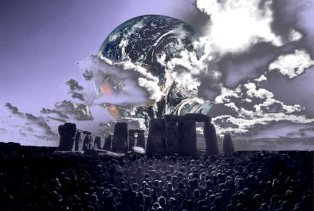 Digitally manipulated image of the earth rising over Stonehenge with a crowd of people in the foreground   Earth element in this image furnished by NASA の写真素材