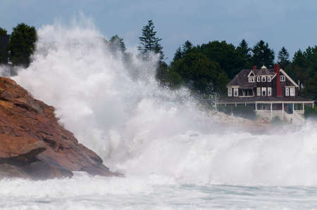Hurricane generated waves crashing on the rocky shoreline of Short Sands Beach, York, Maine USAのeditorial素材