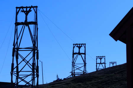 Silhouette of old deserted mining transfer towers in Longyearbyen, Svalbard Norway.の写真素材