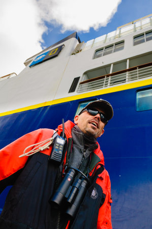 HORNSUND, SVALBARD, NORWAY â€“ JULY 26, 2010: A guide from the National Geographic Explorer...