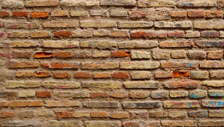 old wall background texture with ancient bricks in red, white, brown and orange colors - horizontal wallpaperの写真素材