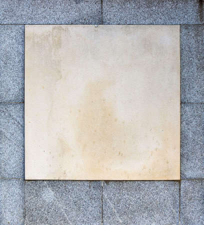Blank memorial plaque of a white and gray stone monument with moisture marks- flat surface backgroundの写真素材