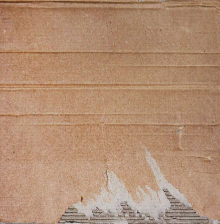Brown cardboard backgrund with wrinkles and broken texture - board backgroundの写真素材