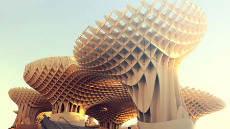 futuristic wooden structure of metropol parasol, as known as setas or mushrooms of incarnation, in the city center of seville - wallpaper or postcardのeditorial素材