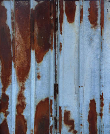 long silver rusty metal sheet plank with rust - industrial dirty background in verticalの写真素材